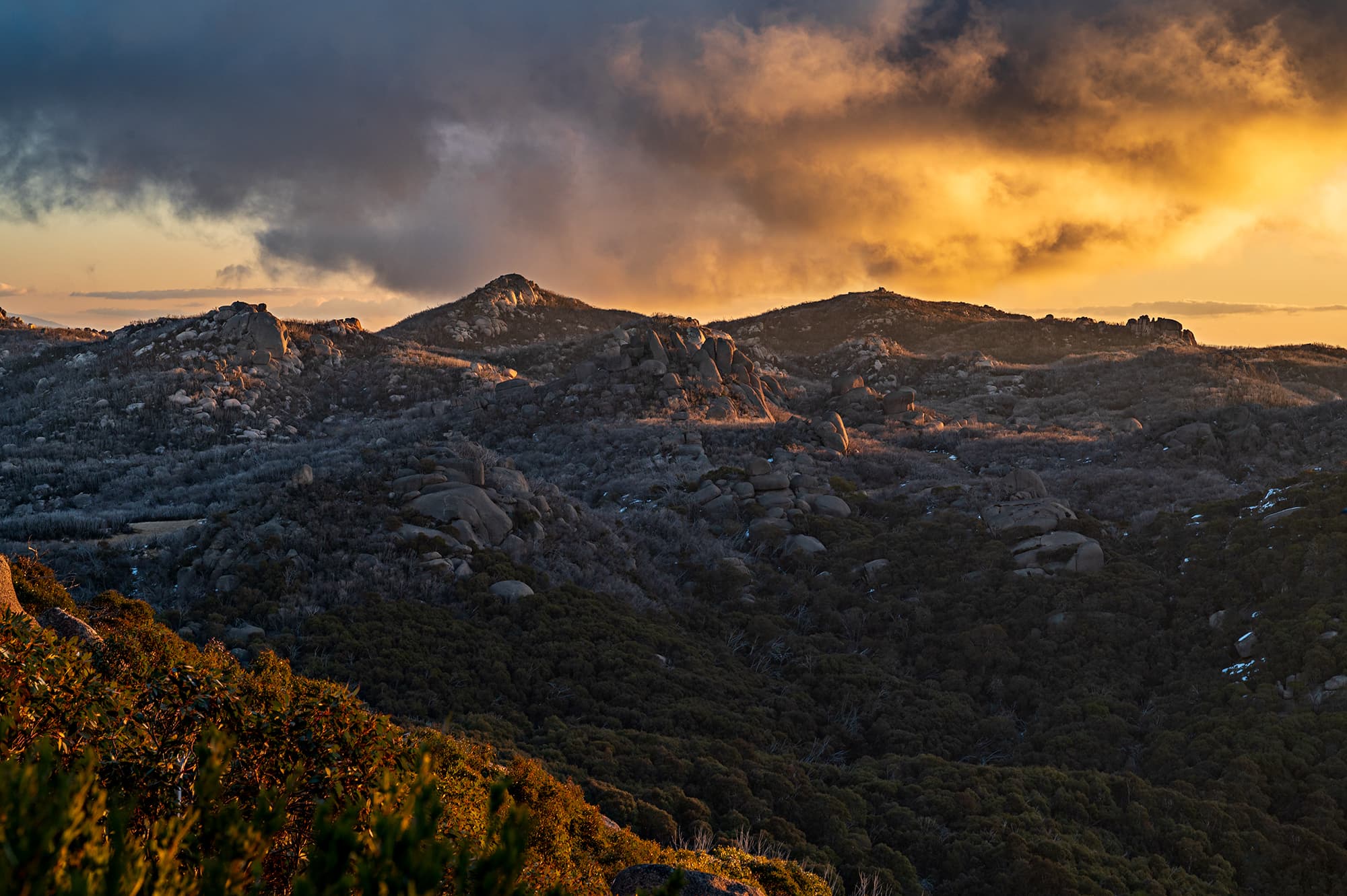 Fading fiery tones across the Mount Buffalo landscape at dusk