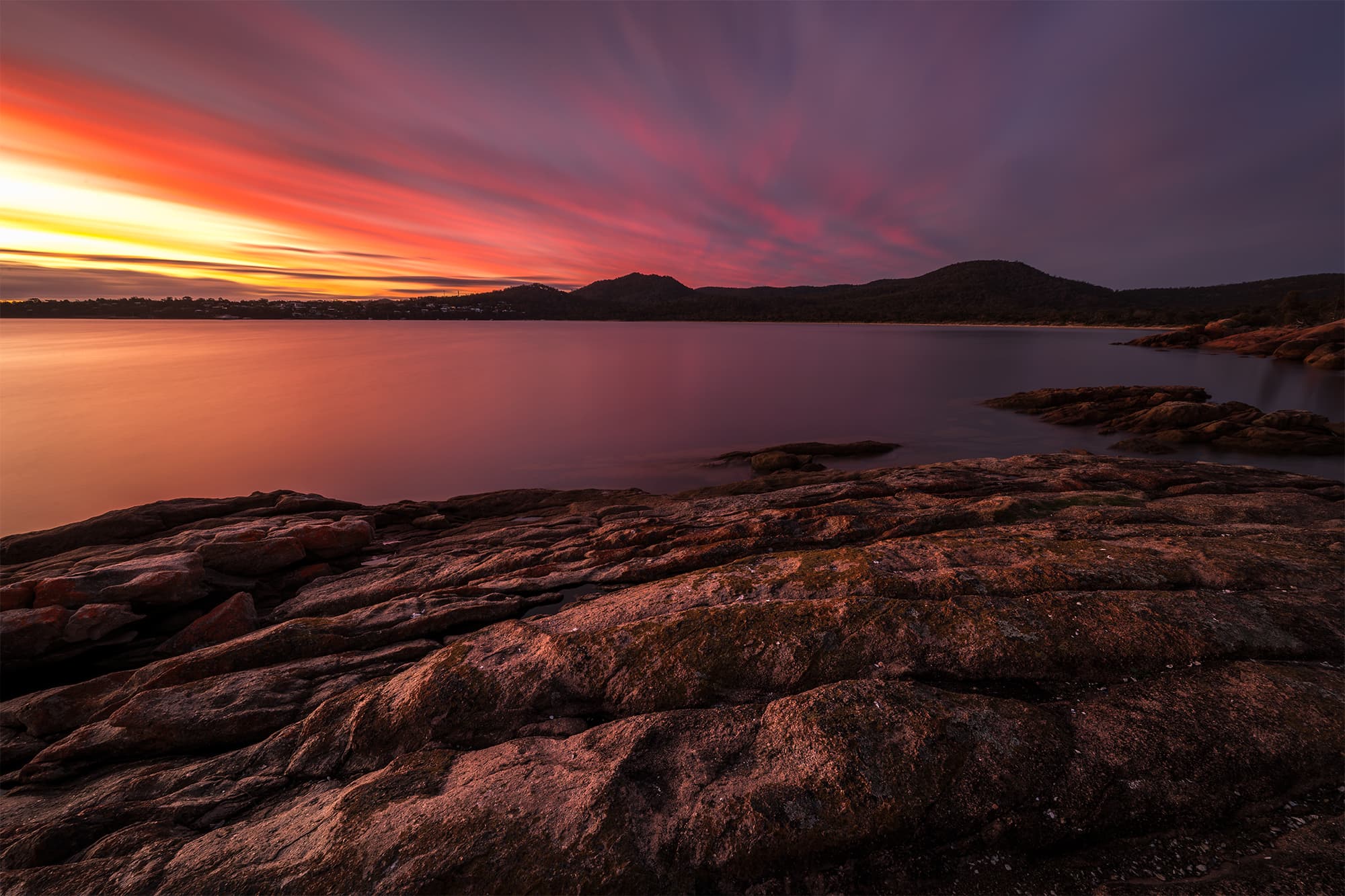 Long exposure ocean movement creating painterly brush strokes at Coles Bay