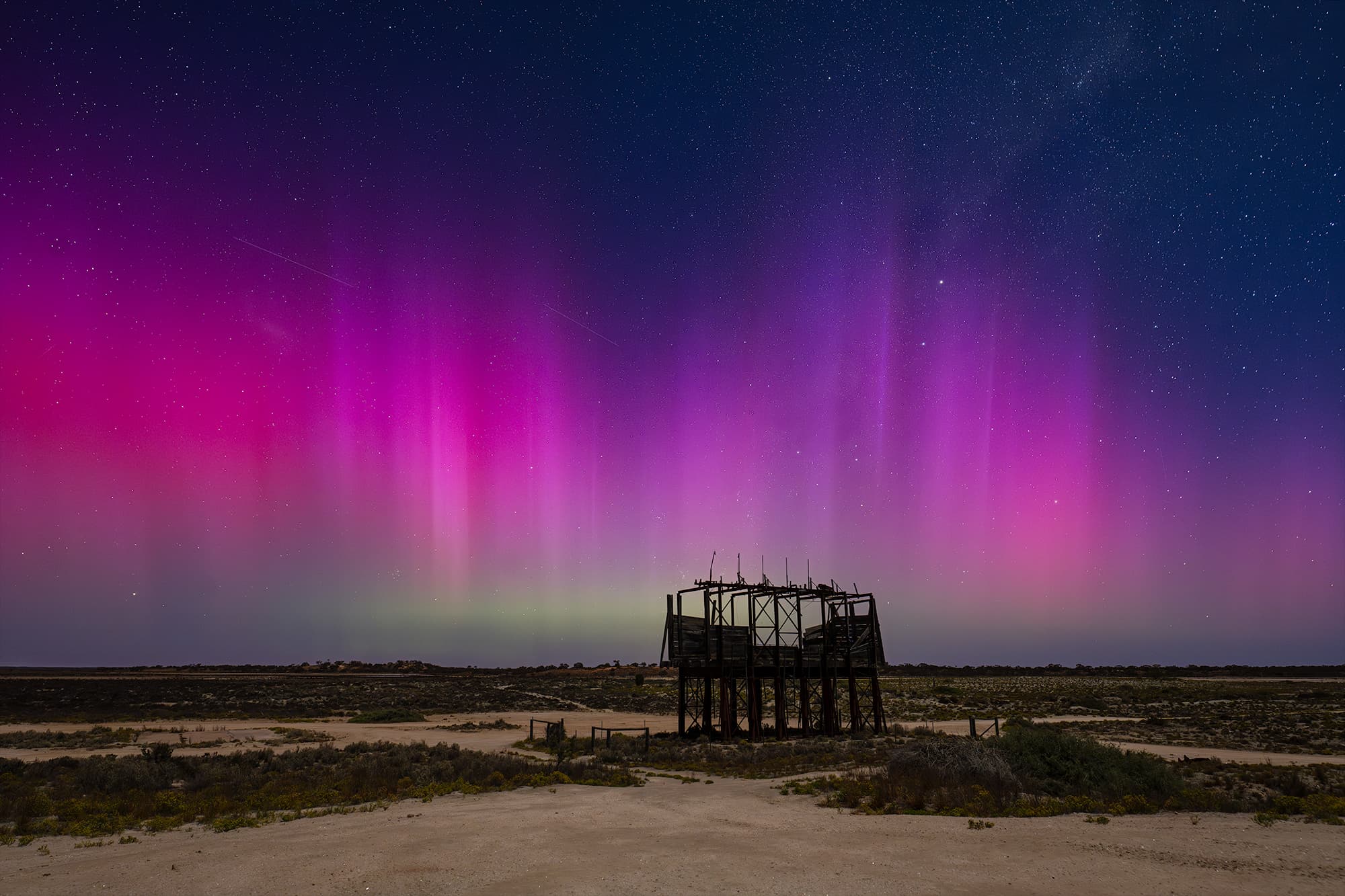 Milky Way rising above an old structure in the landscape