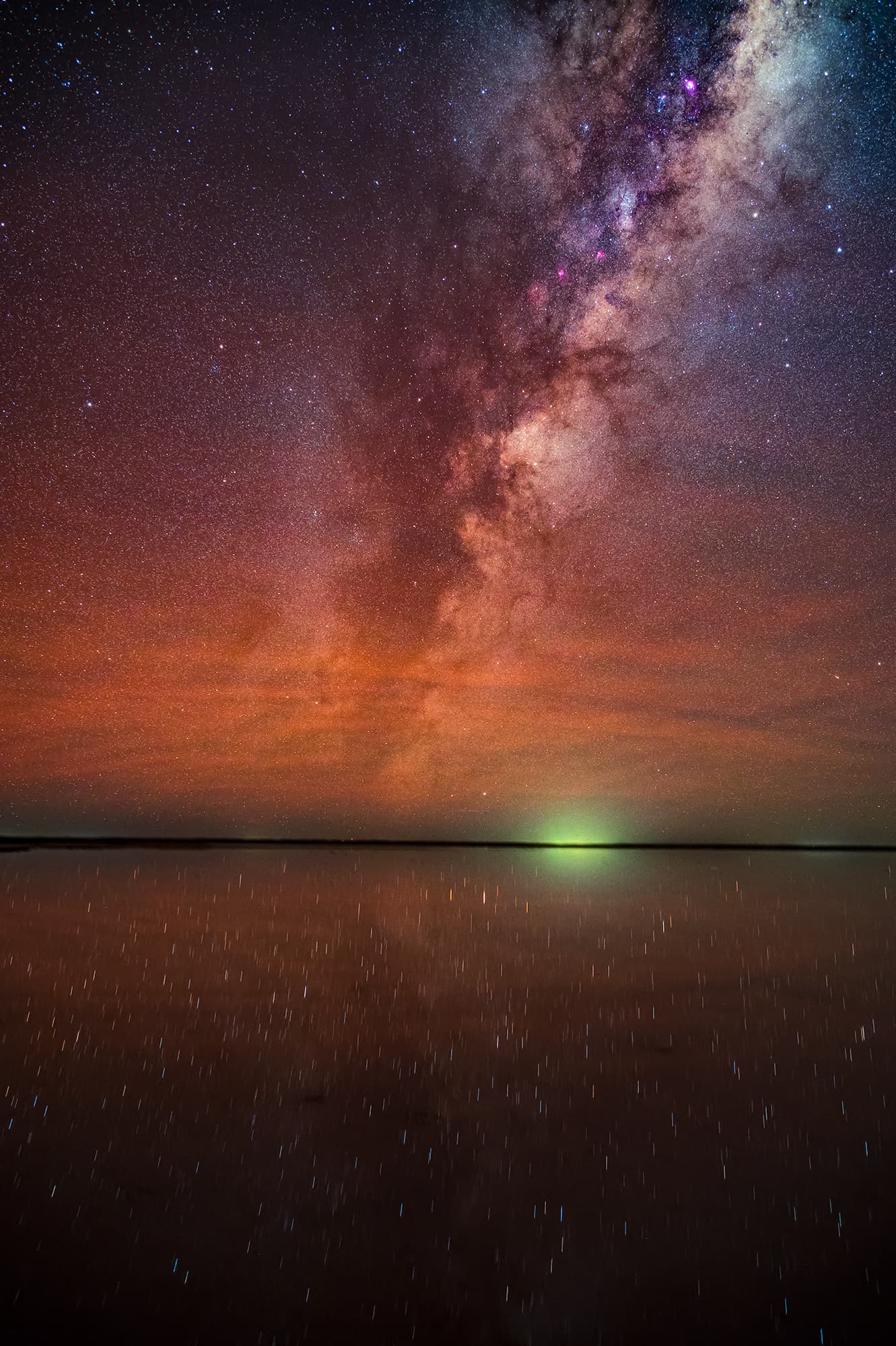 Magical night sky above a dark landscape